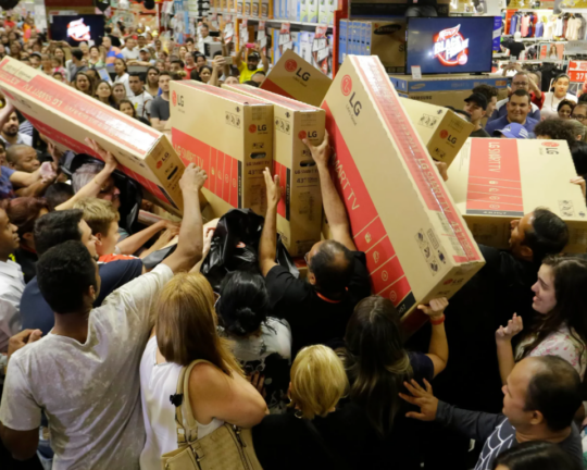 people shopping black friday sales frenzy